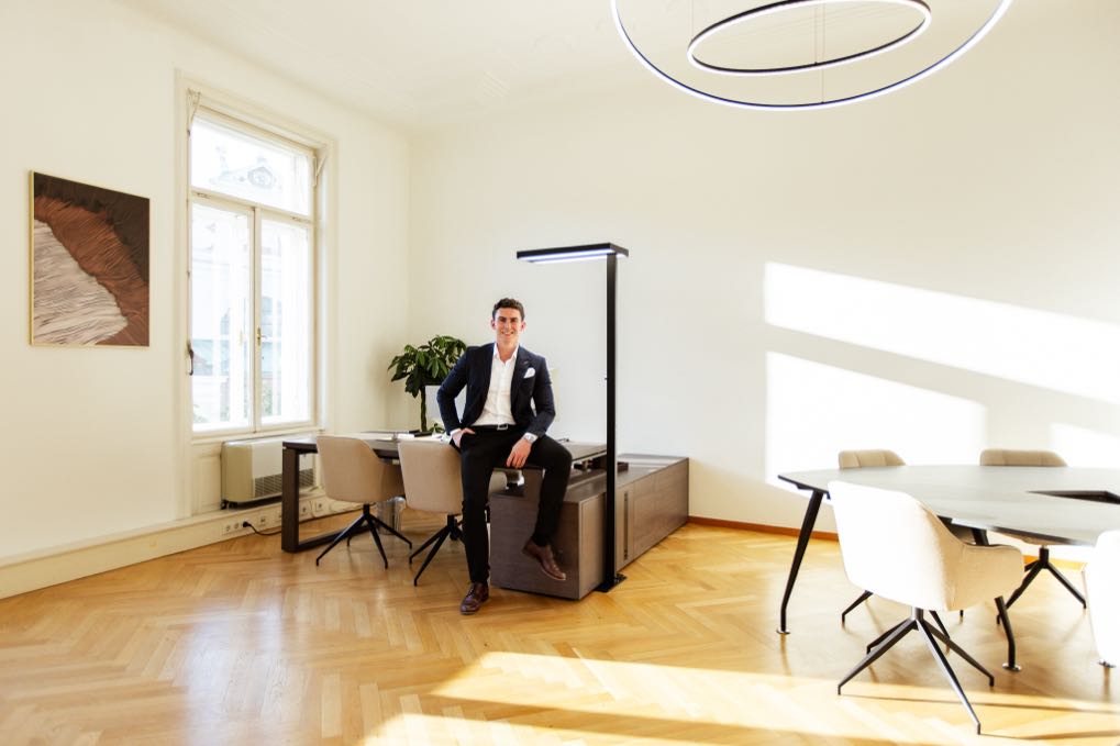 Bright period office with a man at the meeting table