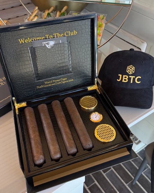 Open cigar box with cigars on a terrace